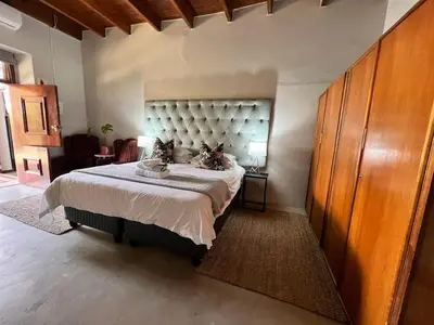 a bedroom with a large bed in a room at Avignon Guesthouse in Worcester