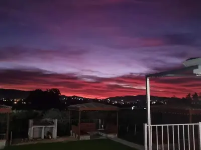 a purple and red sky at night at Val Mor country house in Paarl