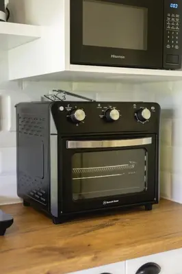 a microwave oven sitting on top of a kitchen counter at 44 on Mountain Drive in Hermanus
