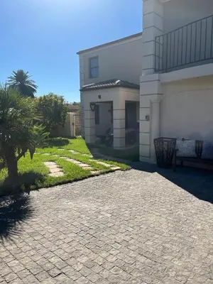 a brick driveway in front of a house at Southern Comfort Guest House in Bellville
