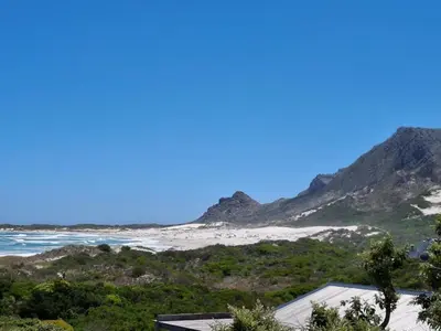 a view of the beach from the house at Alibi at the Sea in Bettyʼs Bay