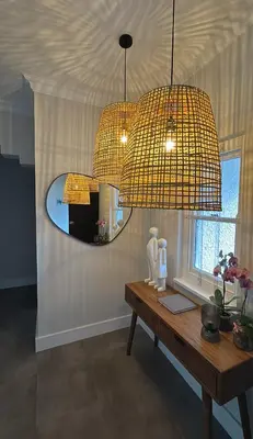a room with a mirror and a table with a table at Stunning Home in Hermanus Town Centre in Hermanus