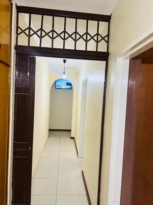 a hallway leading to a room with a door at AFRICAN HAVEN GUEST HOUSE BnB GOODWOOD in Cape Town
