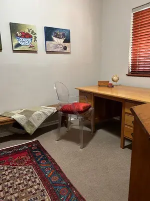 a room with a desk and a chair and a table at Dottie's charming cottage two bedroom apartment and workspace in Paarl
