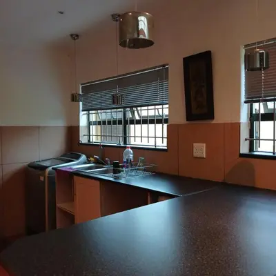 a kitchen with a counter top and a sink at Tripple S in Bellville