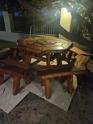 a wooden picnic table and benches in a yard at Cape Golf Villa in Cape Town