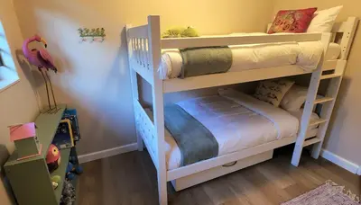 a bedroom with two bunk beds in a room at Tuinvrede Guesthouse in Welgemoed
