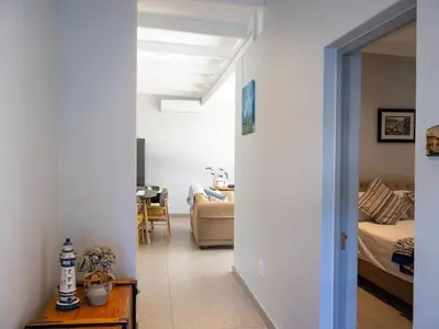 a hallway leading to a living room and a bedroom at The Grey Hound in Strand