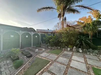 a garden in front of a building at Suite Dreams Gorgeous Garden Holiday Home in Panorama