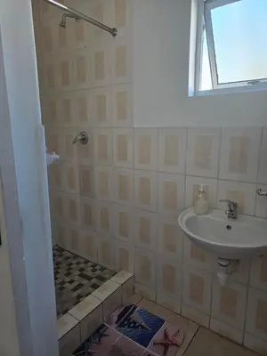 a bathroom with a sink and a shower at Cozy home away from home in Cape Town