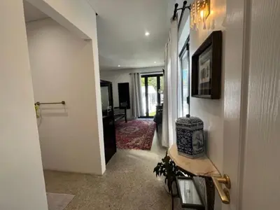 a hallway of a home with a room with at Helder Haven Cottage in Somerset West