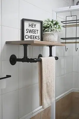 a sign on a shelf in a bathroom at SeeHUYS Boutique Bloubergstrand Beachfront Studio in Bloubergstrand