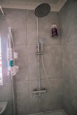 a shower with a shower head in a bathroom at 26 on Balfour Crescent in Silver Sands