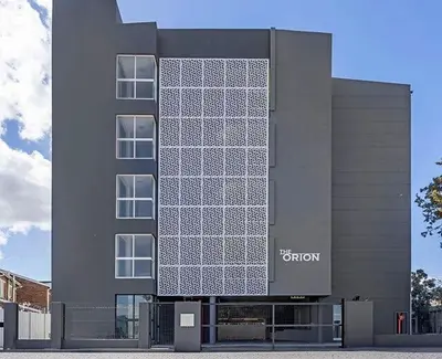 a building with a lot of windows on it at Table Mountain View Apartment in Cape Town