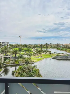 a view of a park with a pond at Olive Apartment on Bridgewaters in Cape Town
