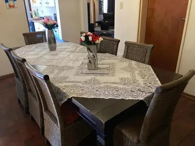a table with flowers in vases on top of it at Halibut Suite in Strand