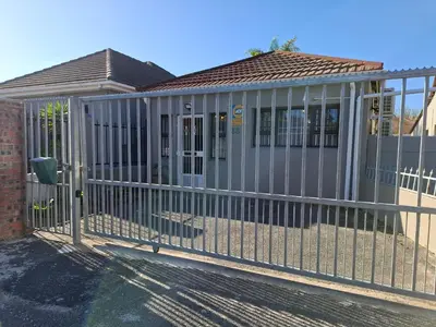 a metal fence in front of a house at Mukuru Okunene in Strand