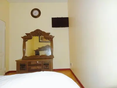 a mirror on a dresser in a bedroom at Ngena Sleep and Go Goodwood in Goodwood