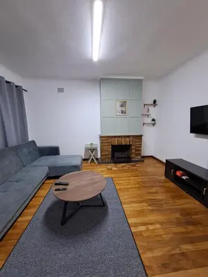 a living room with a couch and a coffee table at Azzure Apartments 6 sleeper Crawford in Cape Town