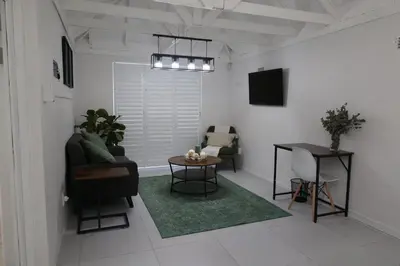 a living room with a couch and a table at 64 On Forest in Cape Town