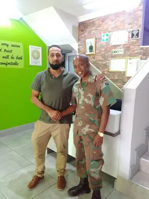 a man and a woman standing next to each other at Camdene Guesthouse in Cape Town