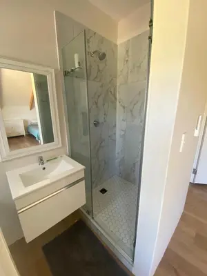 a bathroom with a shower and a sink at Beertjie Bos in Paarl