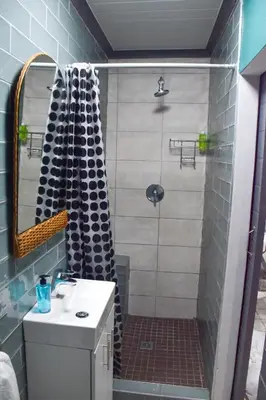 a bathroom with a shower and a sink at Blade Flatlet in Silver Sands