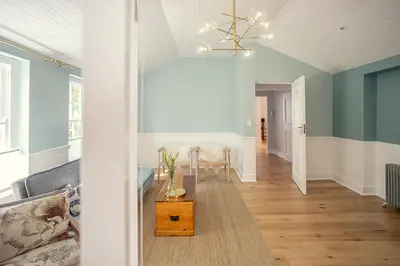 a living room with a couch and a table at Roubaix House - A Heritage Retreat in the Heart of Franschhoek in Franschhoek