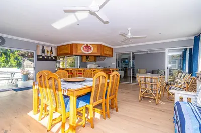 a dining room with a table and chairs at Four Pines in Hermanus