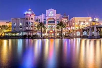 a large building with palm trees in front of it at 8 Sleeper Luxury Duplex Penthouse in Cape Town