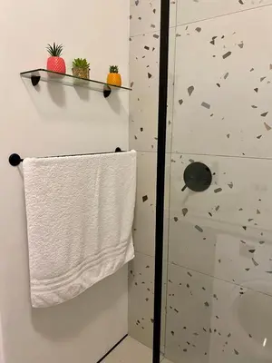 a towel hanging on a towel rack in a bathroom at Studio Apartment 100 meters to Strand Beach in Strand