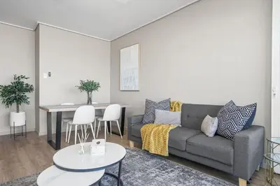 a living room with a couch and a table at Searenity Tides in Cape Town