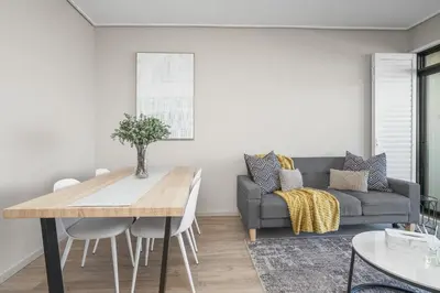 a living room with a table and a couch at Searenity Tides in Cape Town