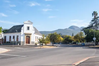 a white building on the side of a street at Olyfberg Rus in Paarl