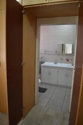 a bathroom with a tub and a sink and a toilet at Pualani Self Catering in Strand
