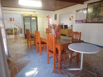 a kitchen and dining room with a table and chairs at Neo & Ruks Guest house parow 1 in Avondale