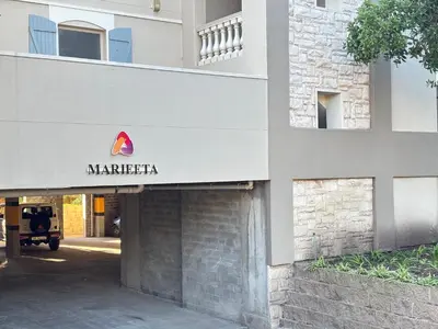 a marriott sign on the side of a building at Spanish Charm in the Heart of Century City Stylish Stay Near Canal Walk! in Cape Town