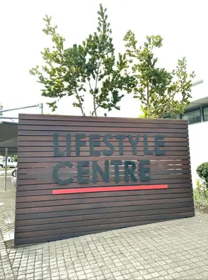 a sign for a disservice center on a sidewalk at Blouberg Luxury Oasis With Pool & Scenic Mountain Views in Cape Town
