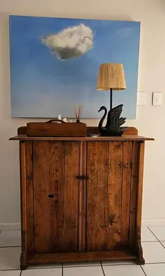 a table with a lamp on top of it at Tamatiebank in Hermanus