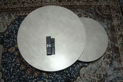 a round table with a remote control in it on a rug at Avon Sand in Cape Town