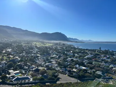 an aerial view of a town next to the water at Central Town Duplex with Pool, BBQ & Mountain View in Hermanus