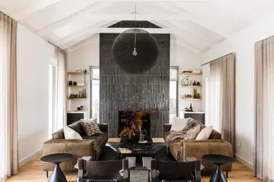 a living room with a couch and chairs at Tide and Timber Luxury Guesthouse in Hermanus