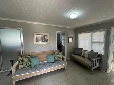 a living room with a couch and a window at Cozy and convenient in Oakdale
