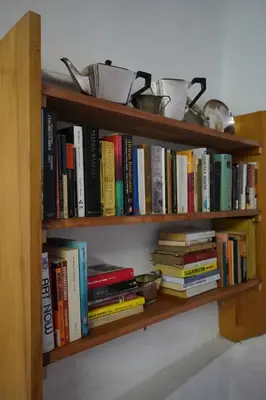 a book shelf filled with lots of books at The Little Gallery in Villiersdorp