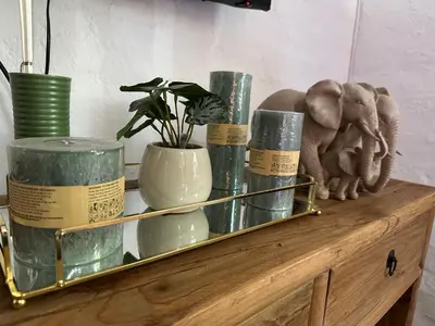a shelf with vases and a elephant figurine on it at 3 Uitsig Street, Rozendal, Stellenbosch in Stellenbosch