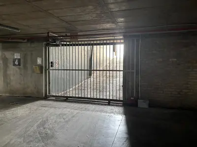 an empty room with a gate in a building at At Leisure Apartment 2 in Stellenbosch