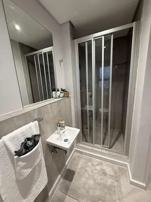 a bathroom with a sink and a shower at Platform 133 2 Tabak in Paarl