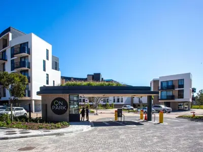 a view of a parking lot with a building at On Park Century City in Cape Town