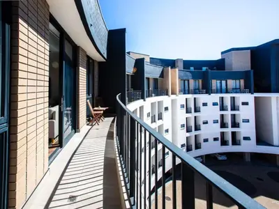 a balcony with a view of a building at On Park Century City in Cape Town