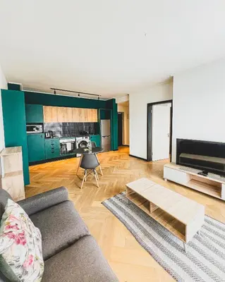 a living room with a couch and a table at 1bedroom Luxe Nine Palms near Canal Walk in Cape Town